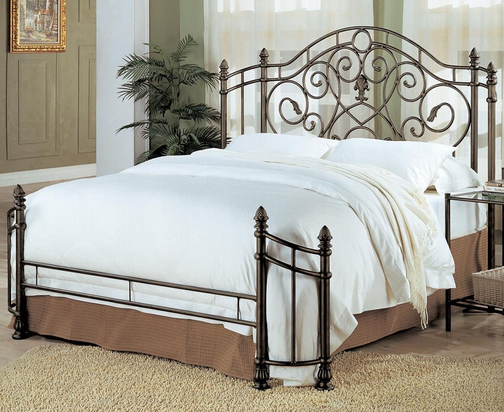 Beckley queen metal bed with iron scrollwork in antique green finish, room setting